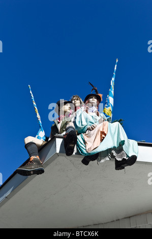 Three life size puppets dressed in Bavarian traditional costumes, Schwabing, Munich Stock Photo