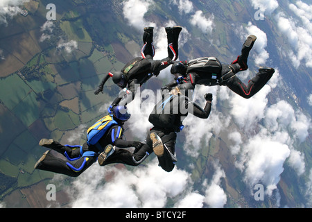 Four skydivers in action Stock Photo