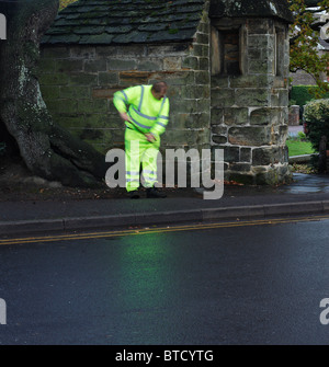 Man sweeping the pavement. Stock Photo