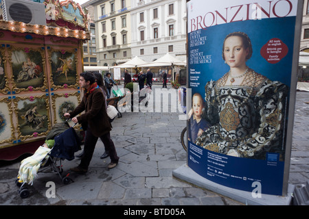 Modern Italian family and Agnolo de Cosimo Bronzino's painting of the Medici Eleanora of Toledo and son Giovanni c1545. Stock Photo