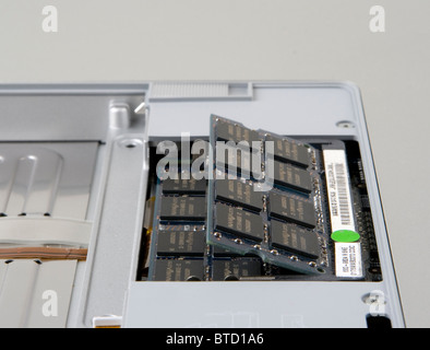 Adding, removing or replacing random access memory (RAM) in a notebook computer Stock Photo