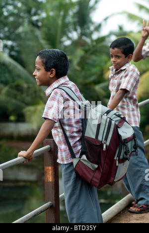 Children waiting to go to school, Alappuzha, Kerala, India. Stock Photo