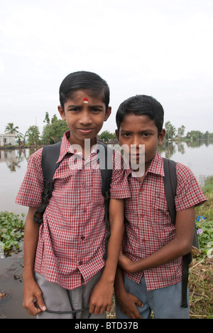 Children waiting to go to school, Alappuzha, Kerala, India. Stock Photo