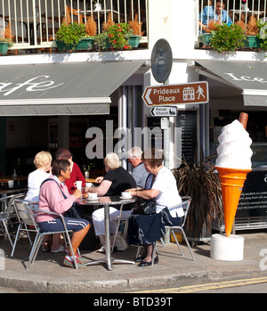 elderly people at a pavement cafe in Padstow, Cornwall, UK Stock Photo