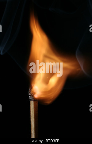 A lighting match Stock Photo