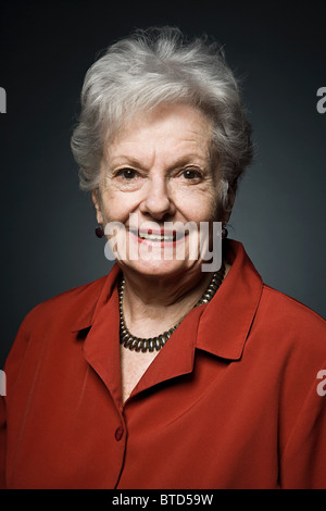 Stuido portrait of cheerful senior woman Stock Photo