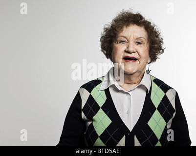 Stuido portrait of cheerful senior woman Stock Photo