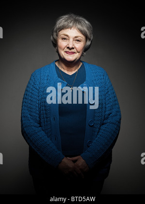 Stuido portrait of cheerful senior woman Stock Photo