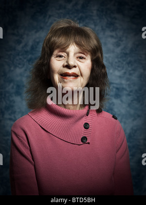 Stuido portrait of cheerful senior woman Stock Photo