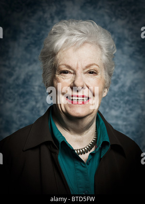 Stuido portrait of cheerful senior woman Stock Photo