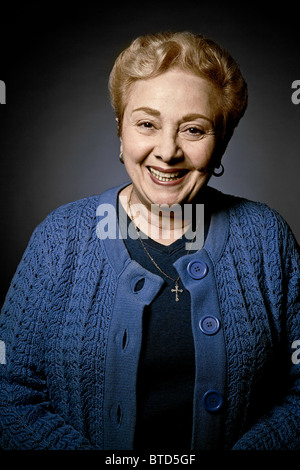 Stuido portrait of cheerful senior woman Stock Photo