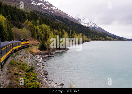 Alaska Railroad's Coastal Classic train travels past Kenai Lake on its way to Seward during the day, Kenai Peninsula, Alaska Stock Photo