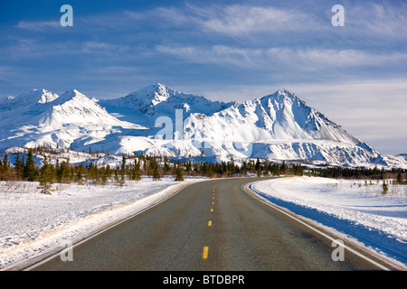 Daytime view of the Richardson Highway along the Delta River just before heading into the Alaska Range, Interior Alaska, Winter Stock Photo
