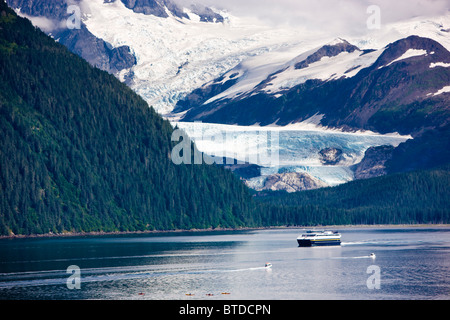 View of Billings Glacier across Passage Canal in Summer with the Alaska State Ferry in the foreground, Whittier, Alaska Stock Photo