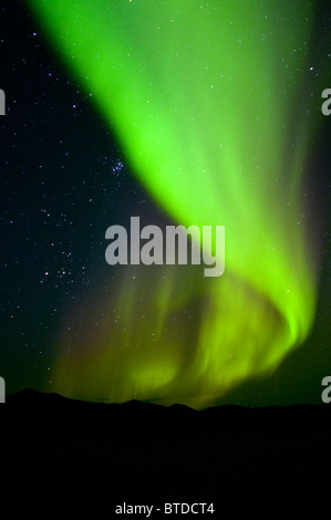 View of green Aurora Borealis over the Noatak River in Gates of the Arctic National Park & Preserve, Arctic Alaska, Fall Stock Photo