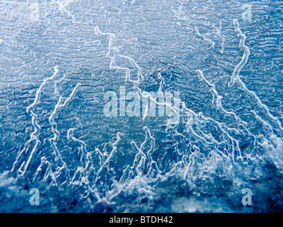 Abstract patterns in the ice during Winter along the Tony Knowles Coastal Trail, Anchorage, Southcentral Alaska Stock Photo