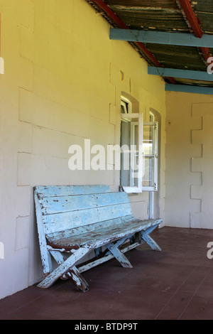 An old wooden bench on a veranda Stock Photo