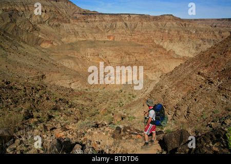 A hiker looking at the view of Fish River Canyon Stock Photo