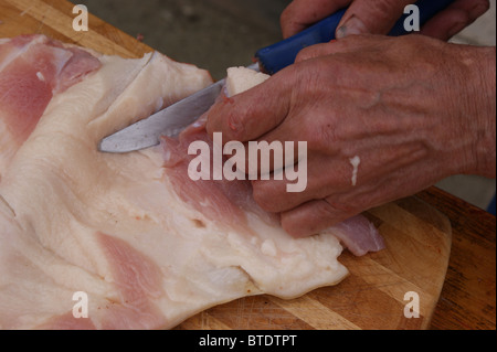 home slaughtering an growing pig in a rural area Stock Photo