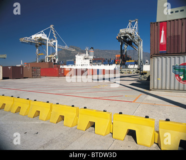 Containers being off loaded onto the pier in Cape Town Harbour Stock Photo