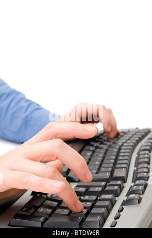Close up of female hands working on a computer keyboard Stock Photo