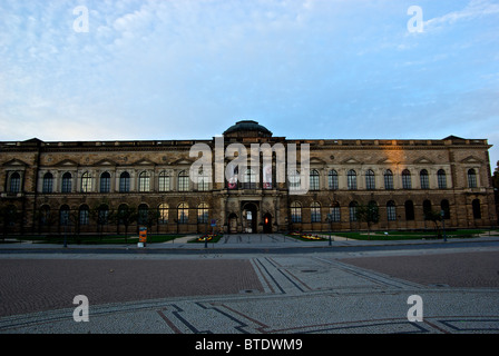 Zwinger Picture Gallery art museum in expansive stone paved Theaterplatz plaza in historic old Altstadt Dresden at sunrise Stock Photo