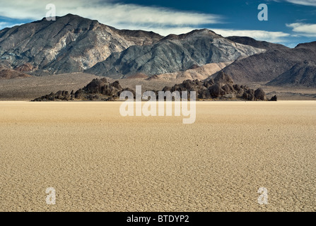 The Grandstand rock, The Racetrack dry lake bottom, Cottonwood Mountains in dist, Mojave Desert, Death Valley, California, USA Stock Photo