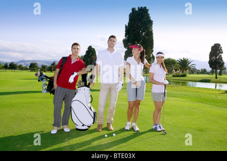 Golf course people group young players team grass field Stock Photo
