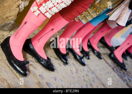 Legs of waiting bullfighters, Seville, Spain Stock Photo