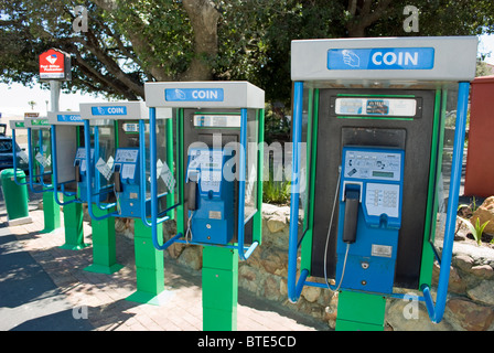 A row of telephone boxes in Gordon's Bay near Cape Town in South Africa. Stock Photo