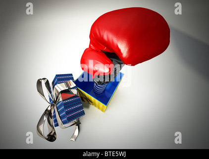 Boxing glove coming out from a gift box Stock Photo