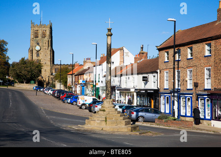 Bedale Market Cross and Church North Yorkshire England Stock Photo