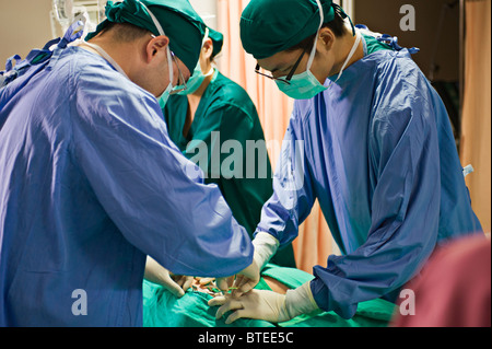 Surgery performed in hospital ICU Stock Photo