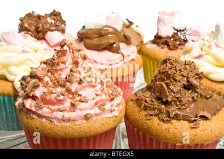 Cupcake background of fancy homemade cupcakes with shallow focus. Stock Photo