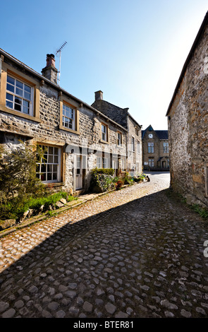 A cobbled street in the Yorkshire Dales village of Grassington, North Yorkshire UK Stock Photo