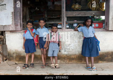 Children waiting to go to school, Alappuzha, Kerala, India. Stock Photo