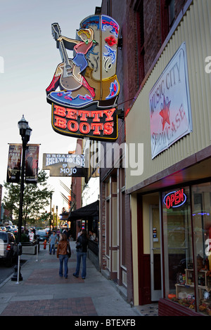 Neon signs outside establishments offering live music on Broadway, in the historic district of Nashville. Stock Photo