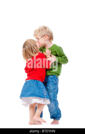 children - brother and sister kissing each other - isolated on white Stock Photo