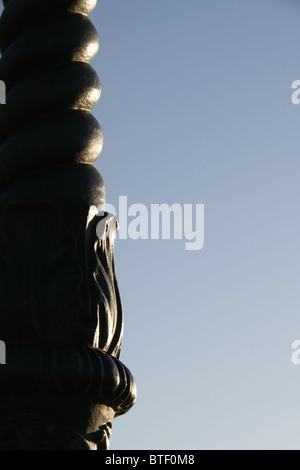 close up detail of one street lamp post pole and blue sky Stock Photo