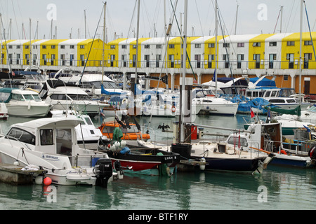 Yachts and boats moored inside Brighton Marina Stock Photo