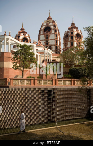 Hare Krishna devote praying in the garden of Iskon Temple, Delhi, India. Stock Photo