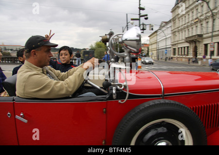 Vintage car drive with child in Prague Stock Photo