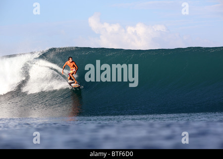 Surfing on Nias Island, Sumatra, Indonesia. Stock Photo