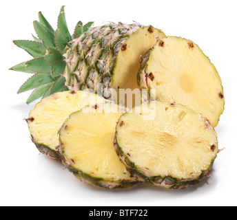 Cut ripe pineapple with rich green rosette. Isolated on a white.