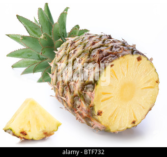 Cut ripe pineapple with rich green rosette. Isolated on a white. Stock Photo