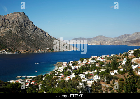 View over the beaches of Myrties and Massouri with Telendos Island to the left, Kalymnos, Greece, Stock Photo