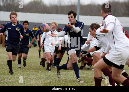 A Yale University player passes the ball against Virginia Tech during a match at the annual Cherry Blossom Rugby Tournament Stock Photo