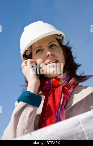Female architect using cell phone, portrait Stock Photo