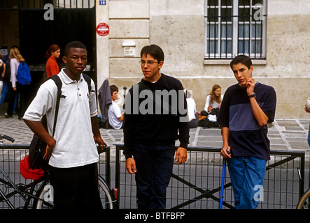 French high school students schoolboys getting together at recess at Lycee Charlemagne in the Marais District in Paris France Stock Photo