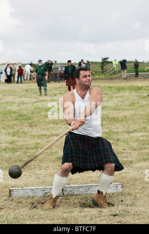 A competitor at the Highland Mey Games, tossing the hammer, in Caithness, SCOTLAND. Stock Photo